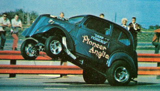 Illustration for article titled Whitewall Tires And Muffler Pipe Rollbars: Drag Racing Back In The Day